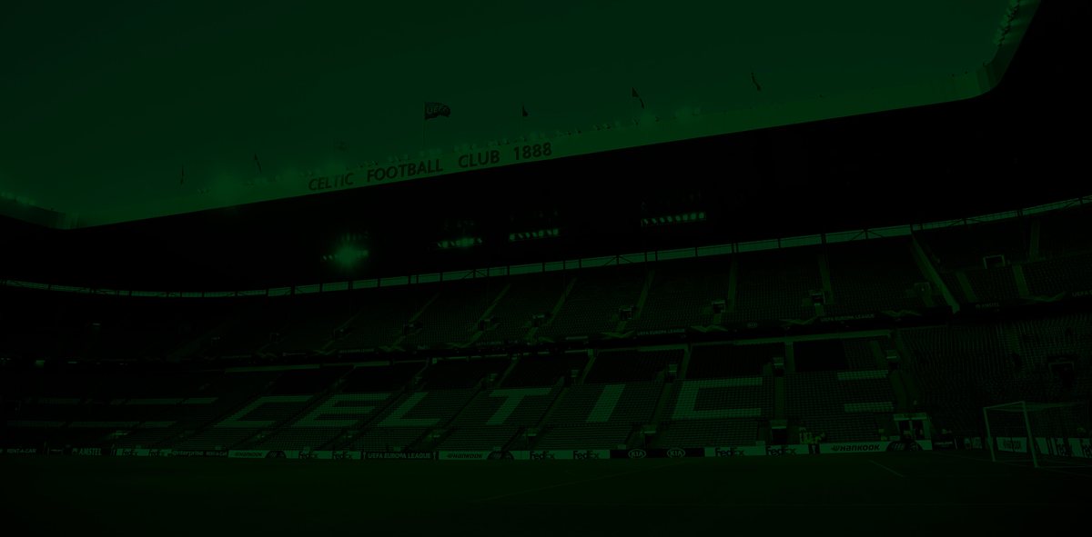 a darkened stadium interior lit in green